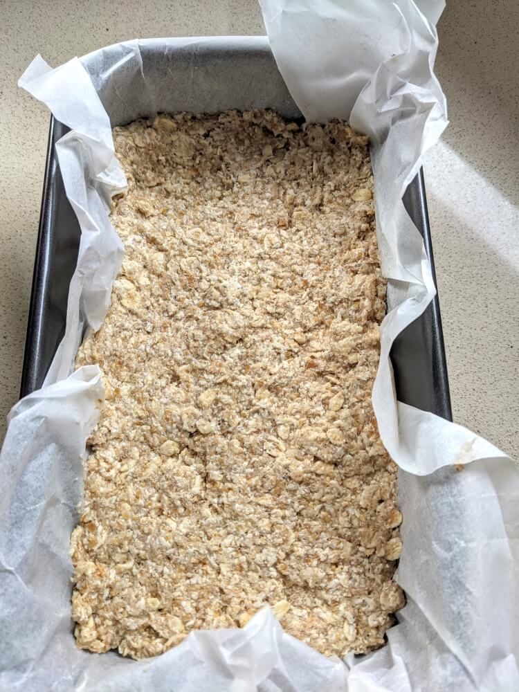 Easy 4-Ingredient oat bread recipe mixture in a baking tin - The Simple Healthy Hub