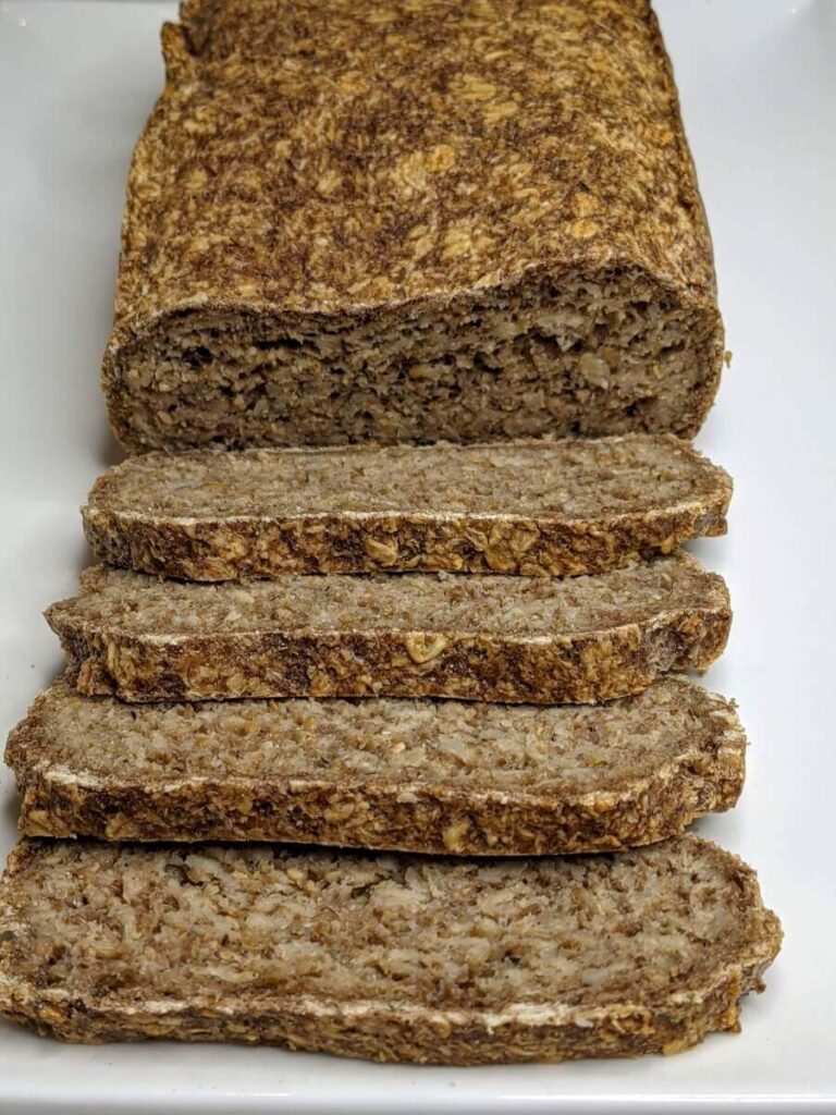 Easy 4-Ingredient oat bread recipe sliced up on a plate - The Simple Healthy Hub