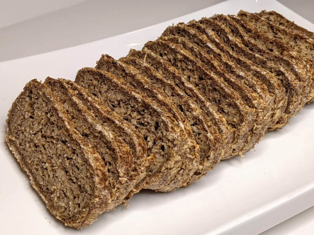 Easy 4-Ingredient oat bread recipe sliced up on a plate - The Simple Healthy Hub