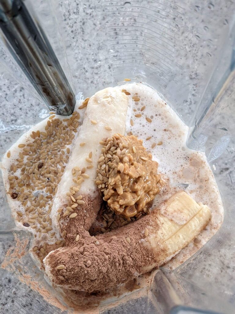 Creamy Chocolate Peanut Butter Smoothie ingredients in a blender - The Simple Healthy Hub