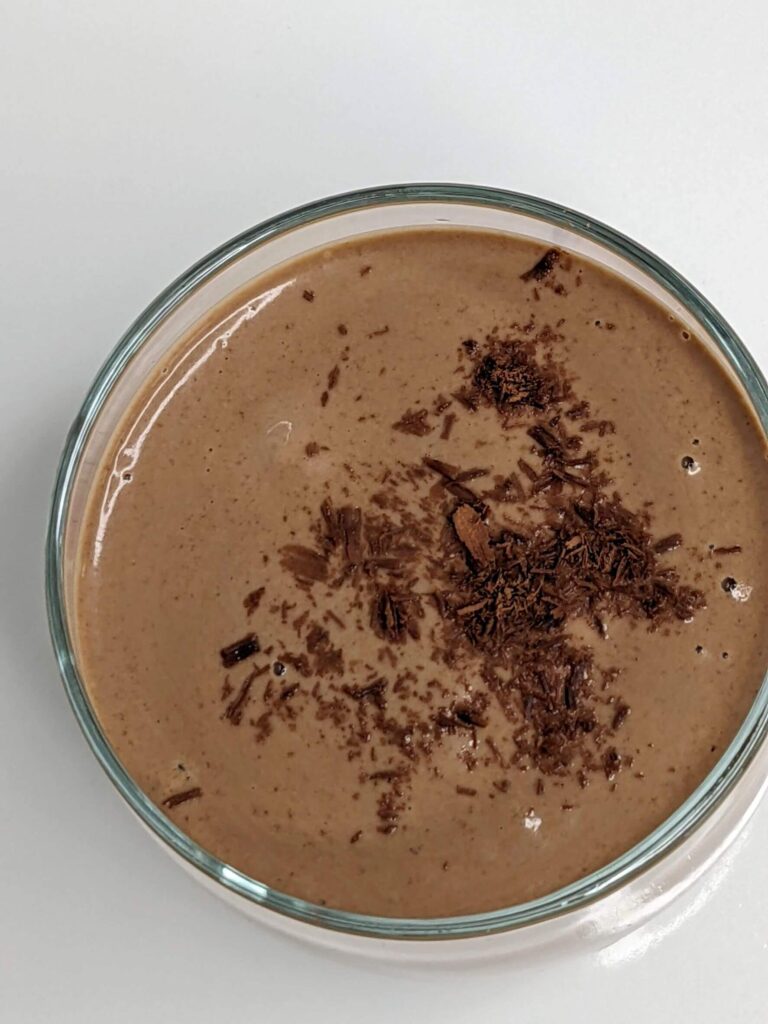 Creamy Chocolate Peanut Butter Smoothie in a glass cup - The Simple Healthy Hub